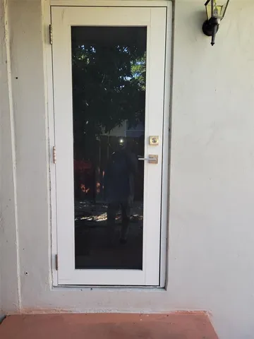 a kitchen with a sink a stove and cabinets