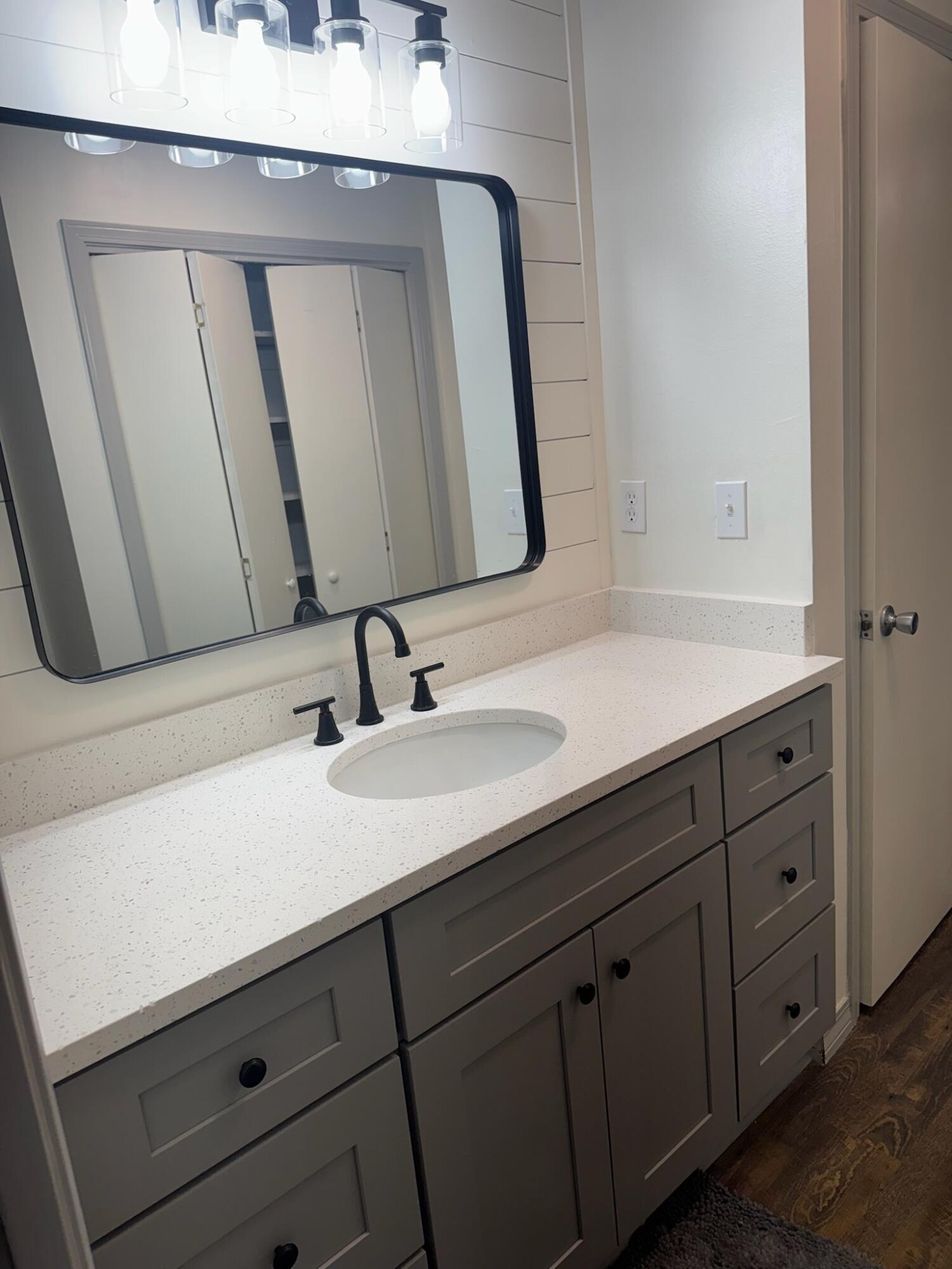 754 Benning Drive Destin, FL 32541 - Photo 3 of 4 a bathroom with a sink and a mirror