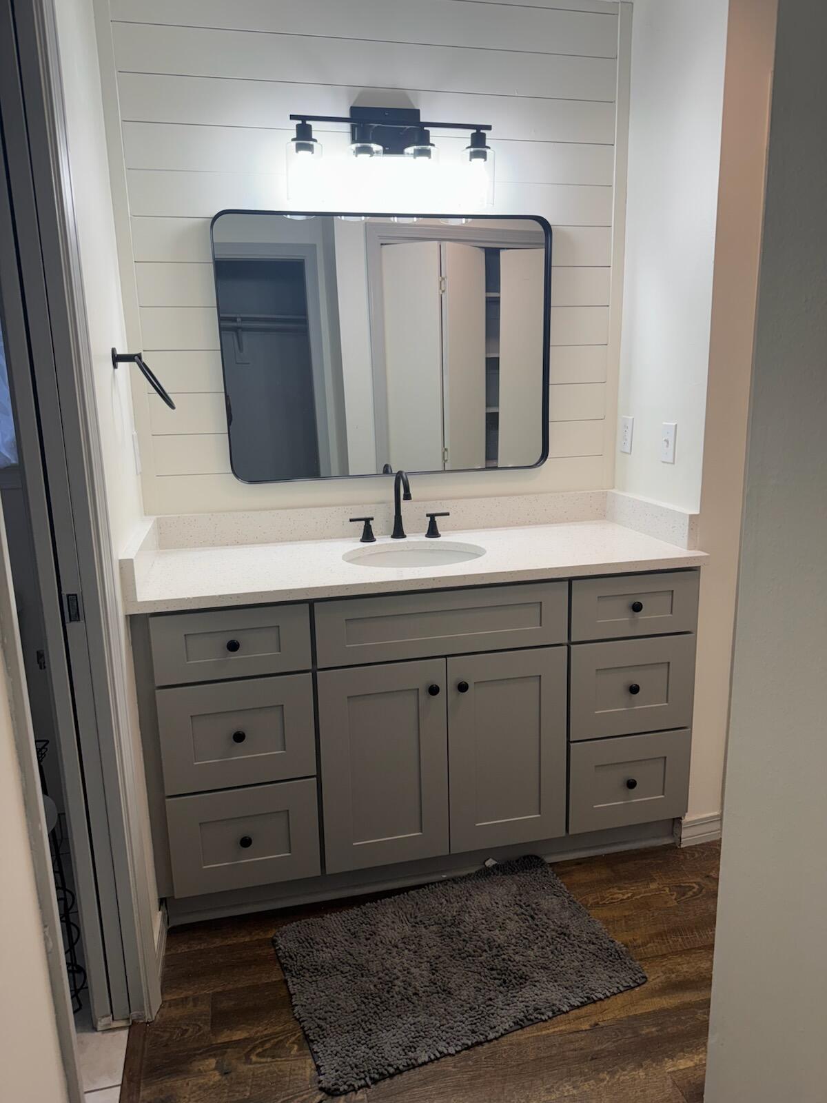 754 Benning Drive Destin, FL 32541 - Photo 4 of 4 a bathroom with a sink vanity and mirror