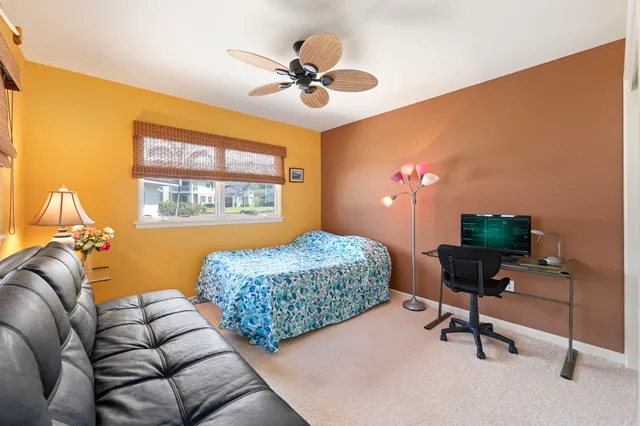a bedroom with furniture and a window