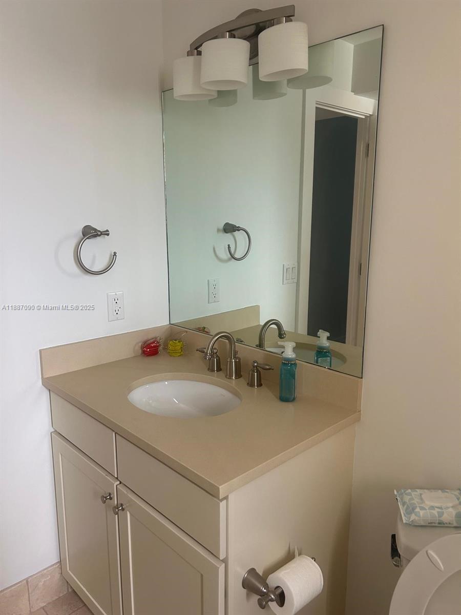 1500 South Ocean Drive, Unit A8 Hollywood, FL 33019 - Photo 23 of 53 a bathroom with a sink and a toilet
