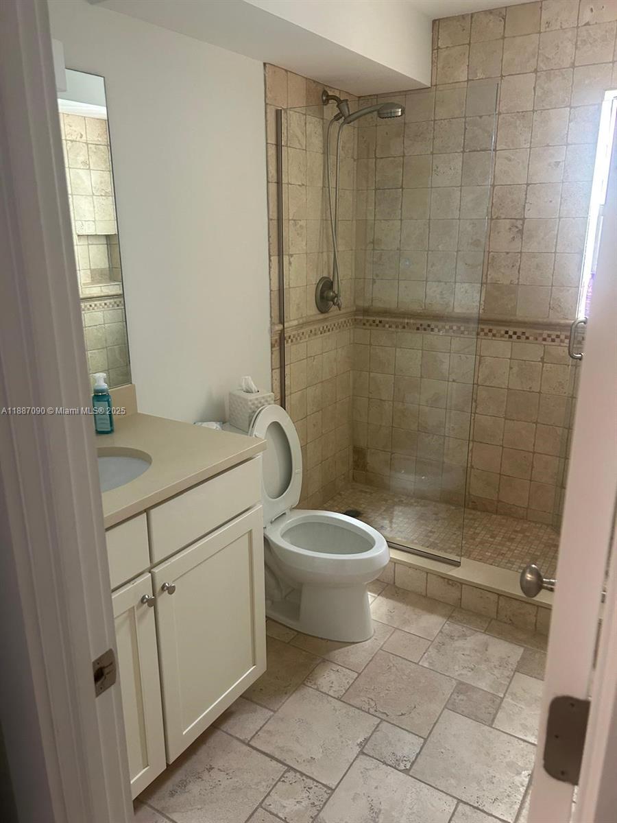 1500 South Ocean Drive, Unit A8 Hollywood, FL 33019 - Photo 24 of 53 a bathroom with a sink a toilet and shower