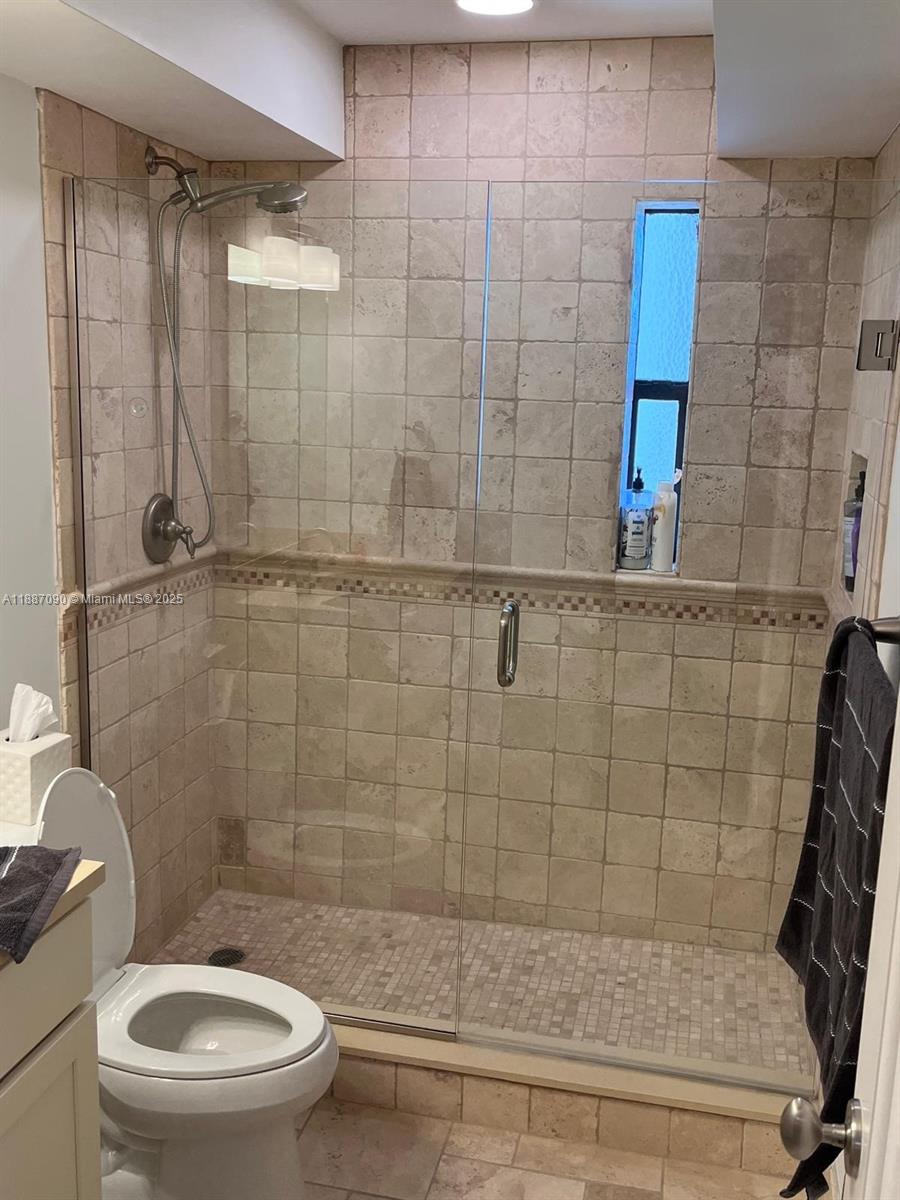 1500 South Ocean Drive, Unit A8 Hollywood, FL 33019 - Photo 25 of 53 a bathroom with a shower and toilet