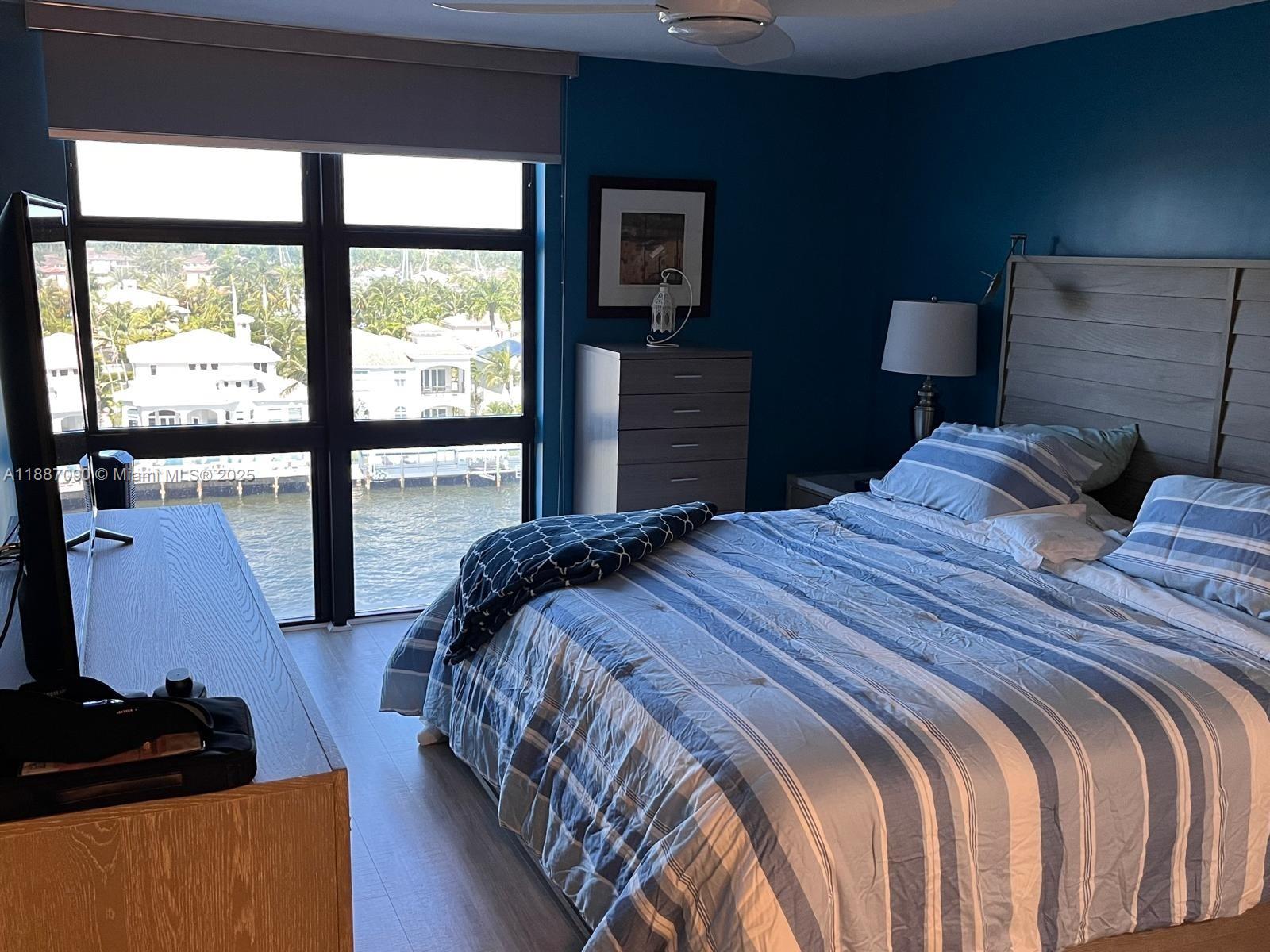 1500 South Ocean Drive, Unit A8 Hollywood, FL 33019 - Photo 28 of 53 a bedroom with a bed and glass window