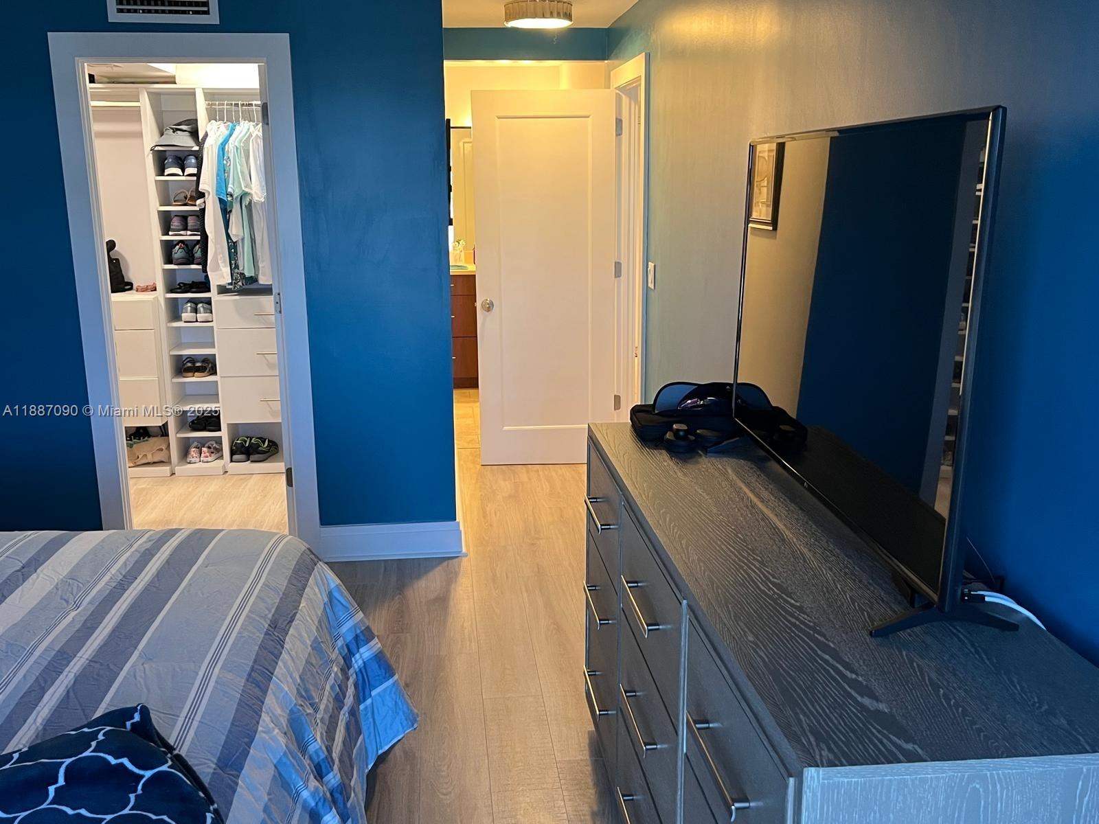 1500 South Ocean Drive, Unit A8 Hollywood, FL 33019 - Photo 29 of 53 a bedroom with a bed and a dresser