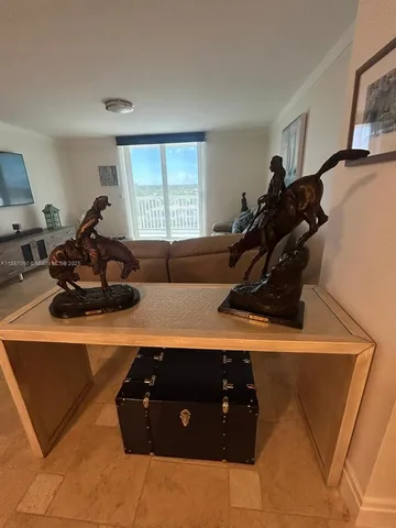 a view of a workspace with kitchen countertops and furniture