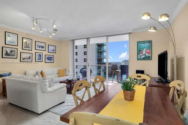 a living room with fireplace furniture and a flat screen tv