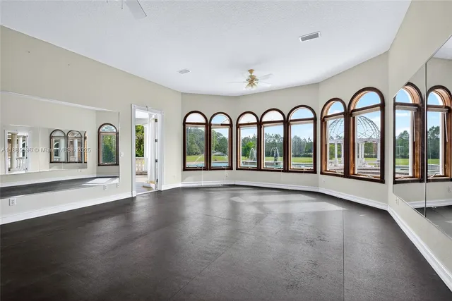 a bathroom with a tub and a toilet