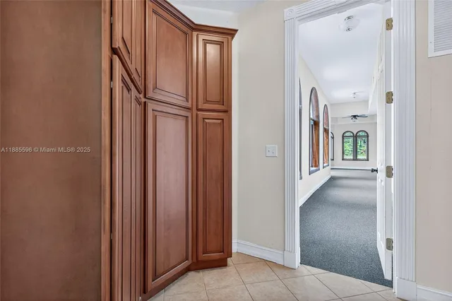 a view of a big room with entryway and stairs