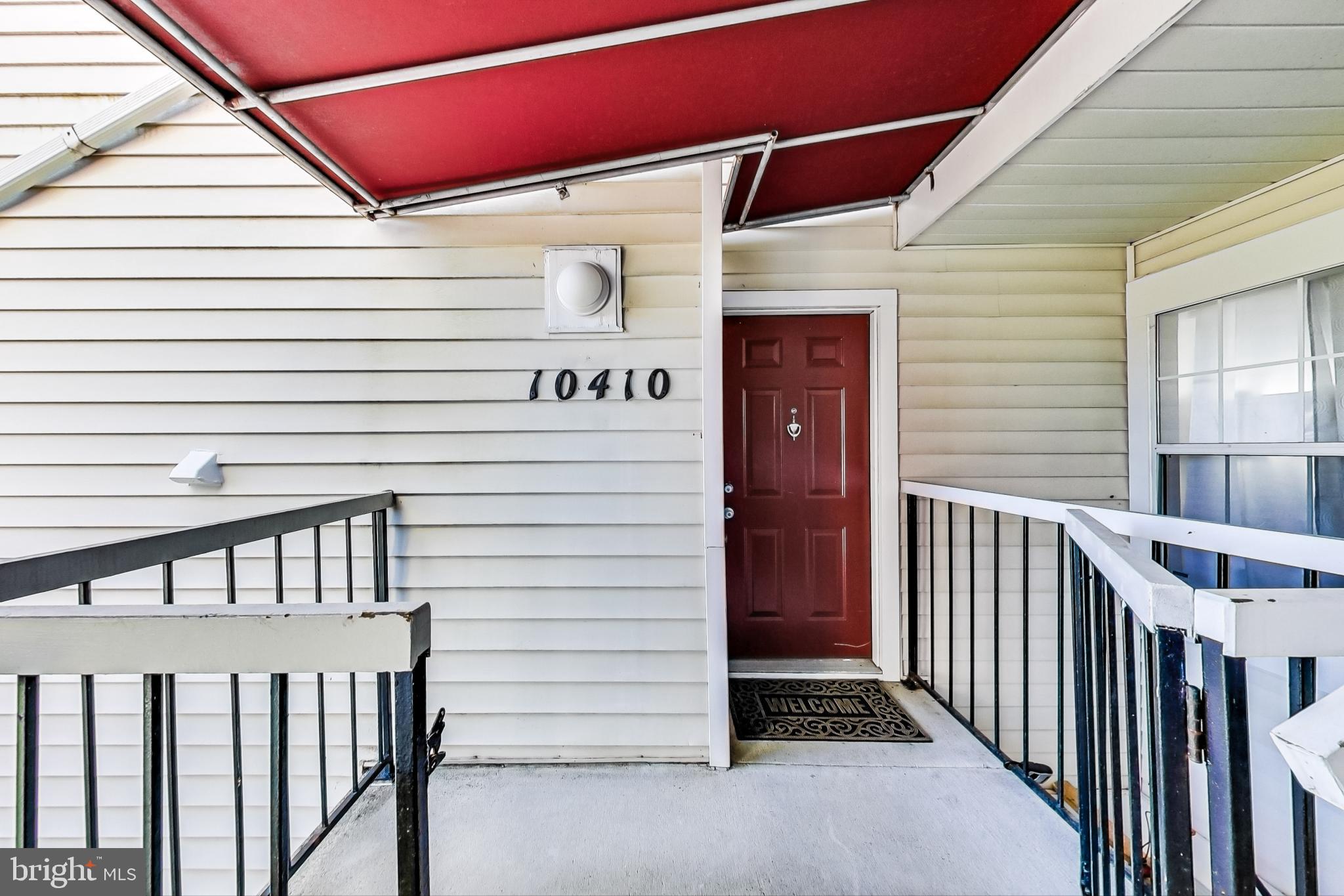 10410 Beacon Ridge Drive, Unit 202 Bowie, MD 20721 - Photo 2 of 47 Unit Exterior Front Door and Covered Front Porch
