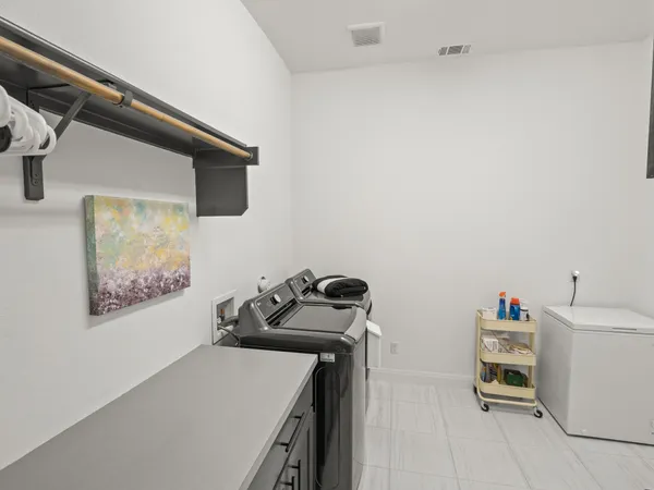 a bedroom with a bed and a wooden floor