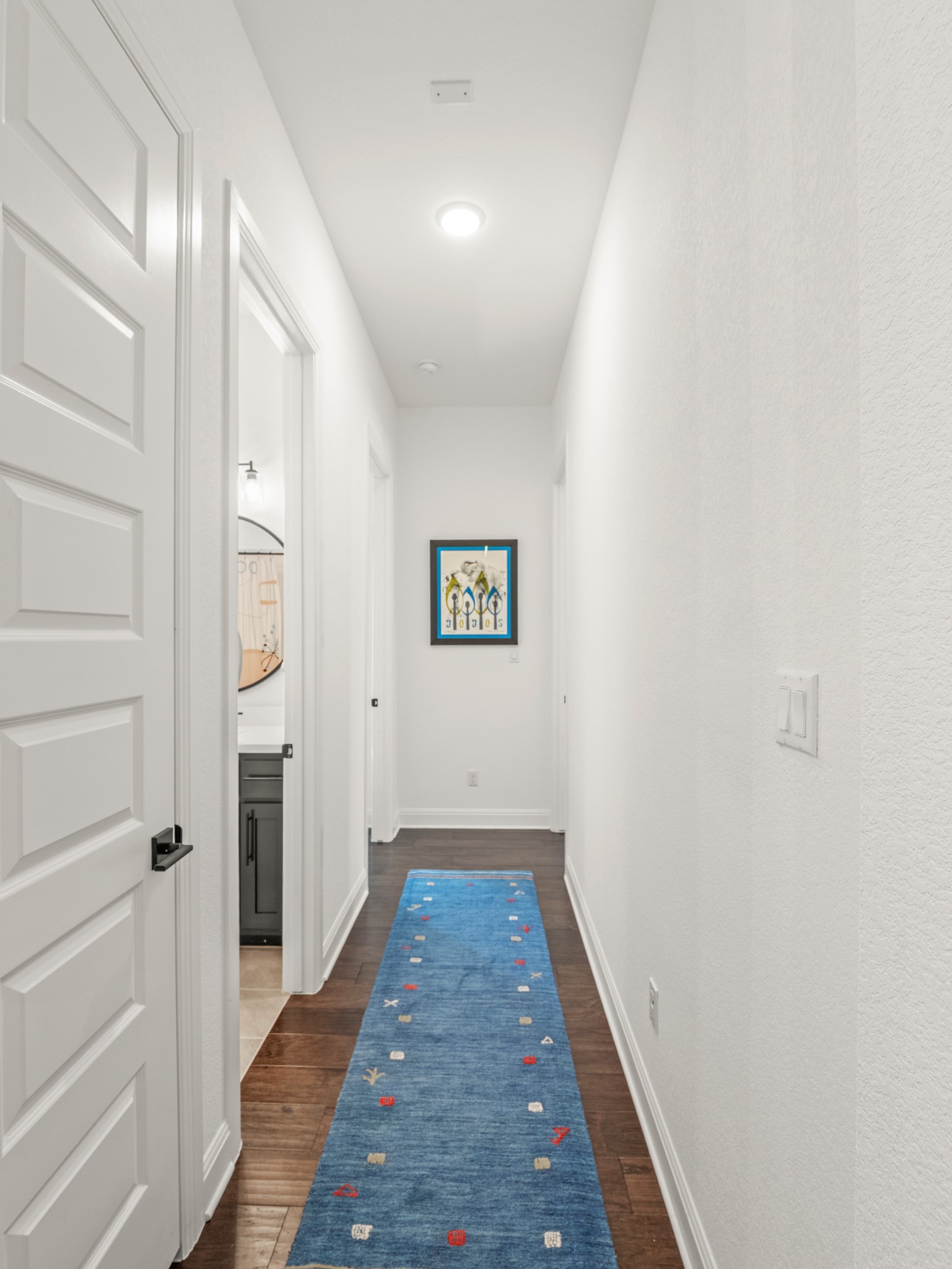 120 Eagle Pass Trail Georgetown, TX 78628 - Photo 18 of 32 a view of a hallway with wooden floor