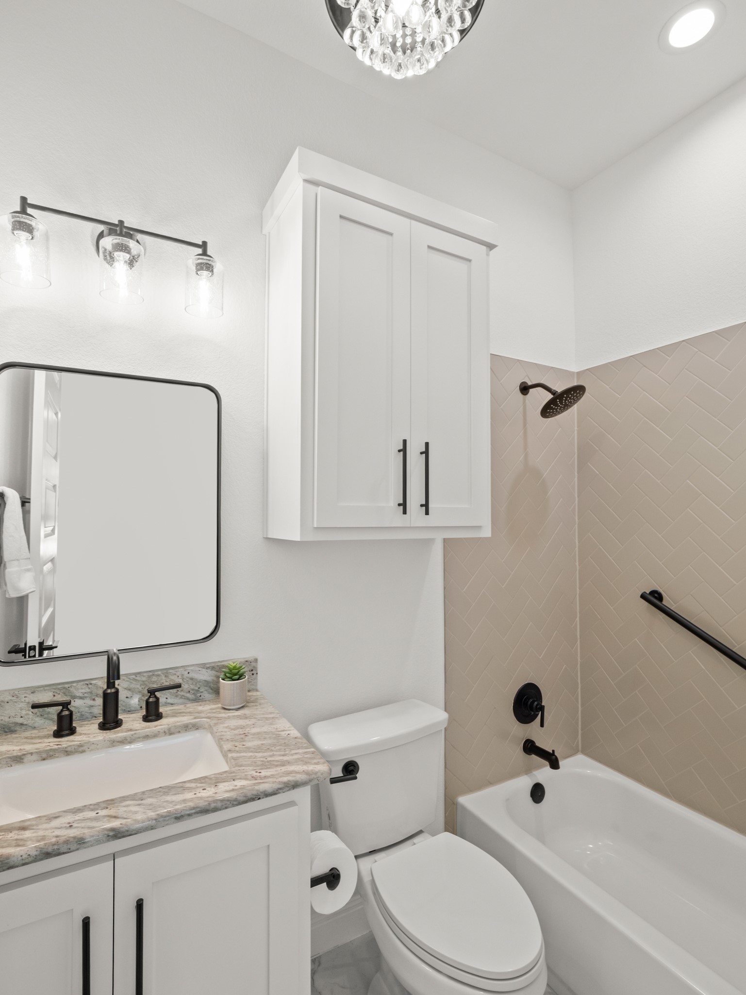 120 Eagle Pass Trail Georgetown, TX 78628 - Photo 22 of 32 a bathroom with a granite countertop sink toilet a mirror and shower