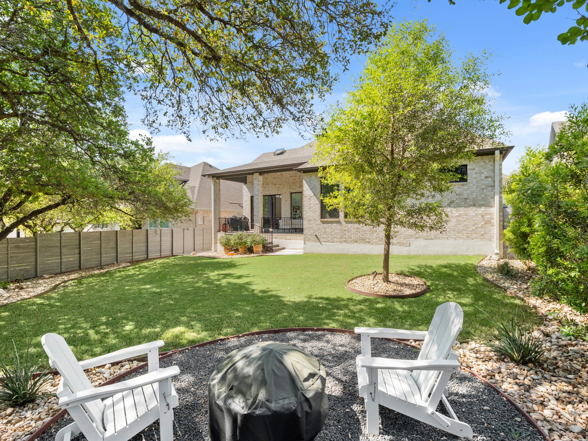 120 Eagle Pass Trail Georgetown, TX 78628 - Photo 25 of 32 a view of backyard of house with green space and seating area