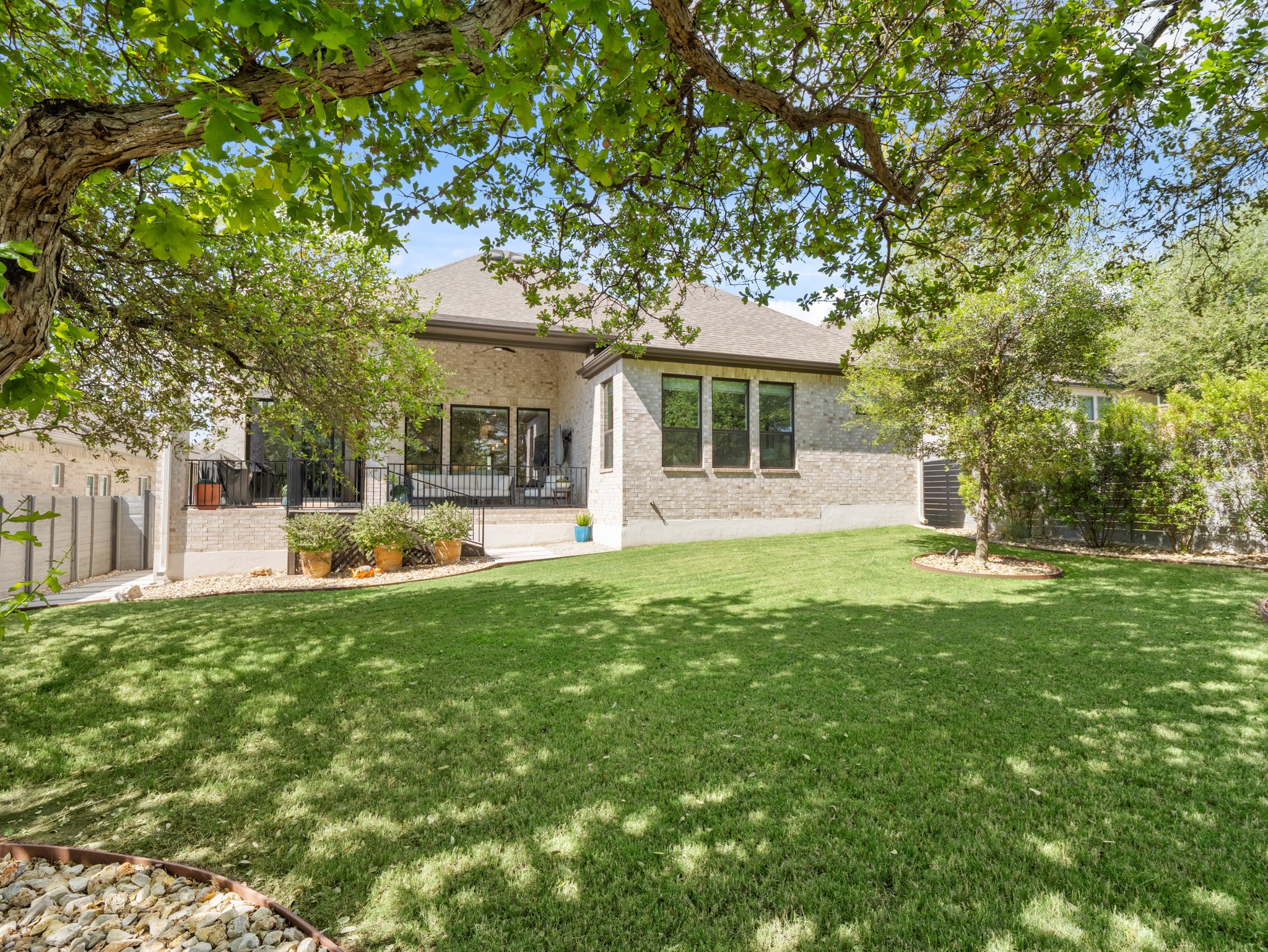 120 Eagle Pass Trail Georgetown, TX 78628 - Photo 26 of 32 a front view of a house with yard and green space
