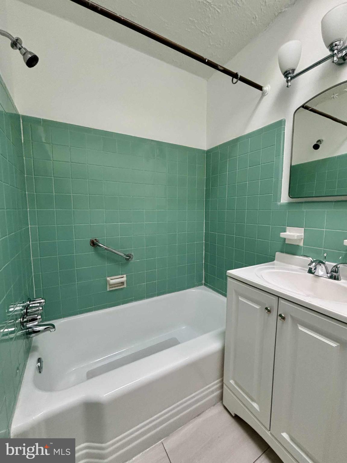 1303 East Johnson Street, Unit 2 Philadelphia, PA 19138 - Photo 2 of 12 a bathroom with a bathtub and a sink