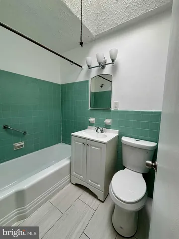 a bathroom with a bathtub and a sink