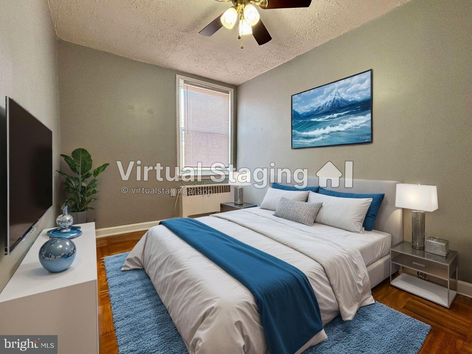 1303 East Johnson Street, Unit 2 Philadelphia, PA 19138 - Photo 8 of 12 a bedroom with bed and a potted plant