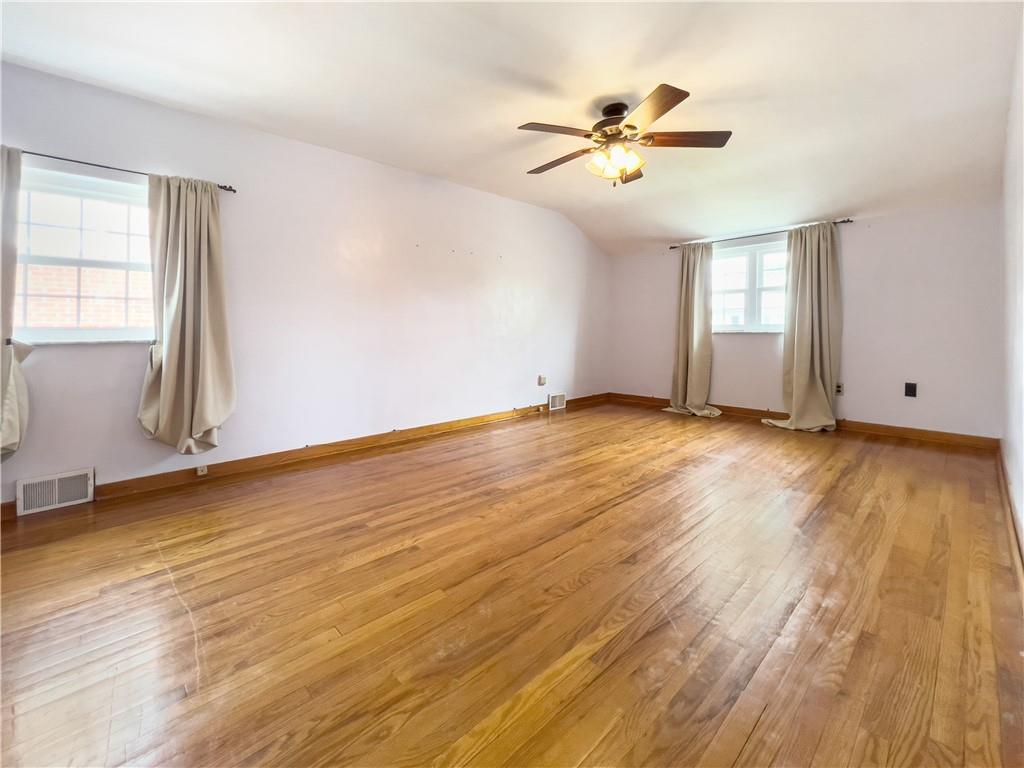 2023 Spring Hill Road Pittsburgh, PA 15243 - Photo 14 of 20 a view of an empty room with wooden floor and a window
