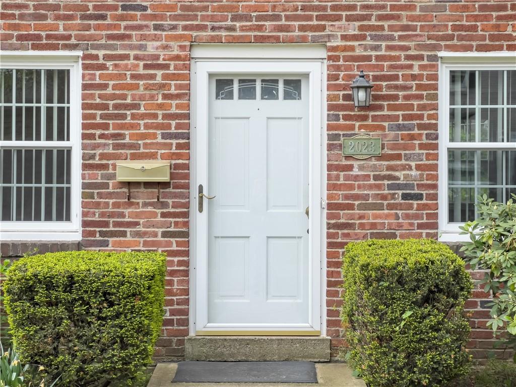 2023 Spring Hill Road Pittsburgh, PA 15243 - Photo 2 of 20 a brick house with a large windows
