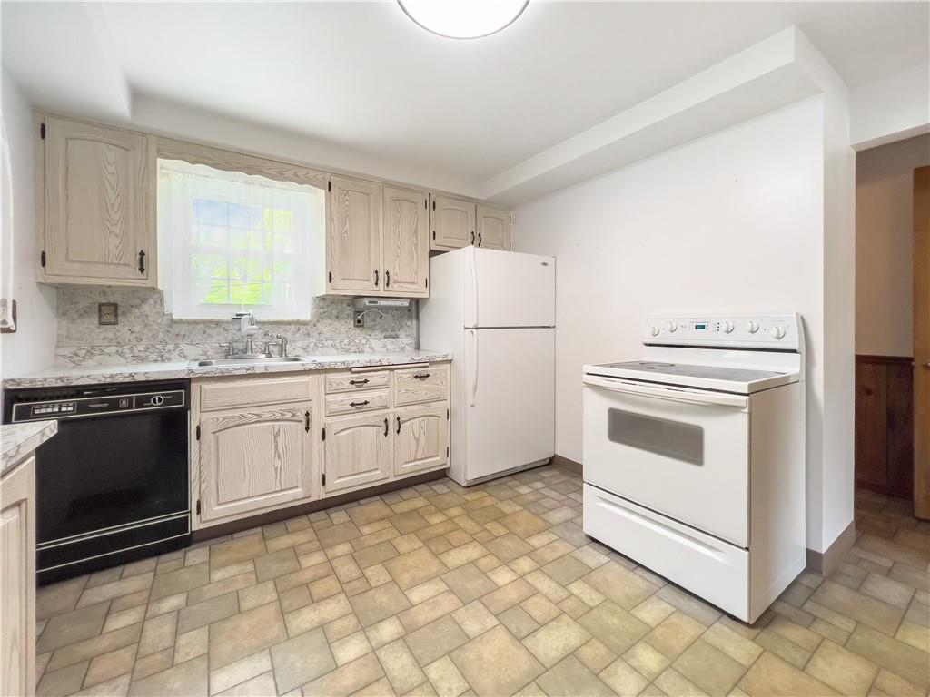 2023 Spring Hill Road Pittsburgh, PA 15243 - Photo 7 of 20 a kitchen with granite countertop white cabinets and white appliances