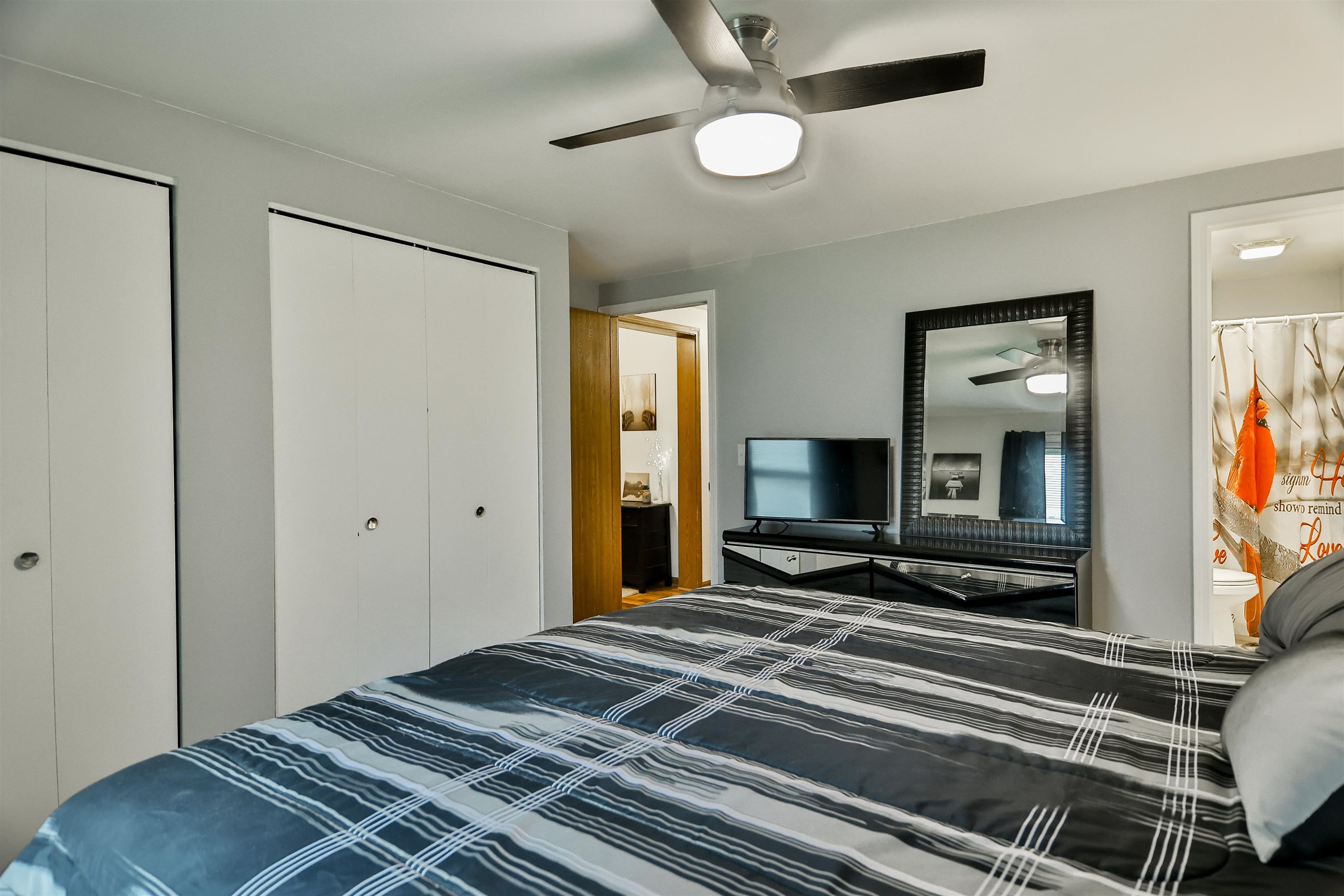 155 Lamplighter Loop Southeast Poplar Grove, IL 61065 - Photo 16 of 31 a bedroom with a bed and a flat tv screen