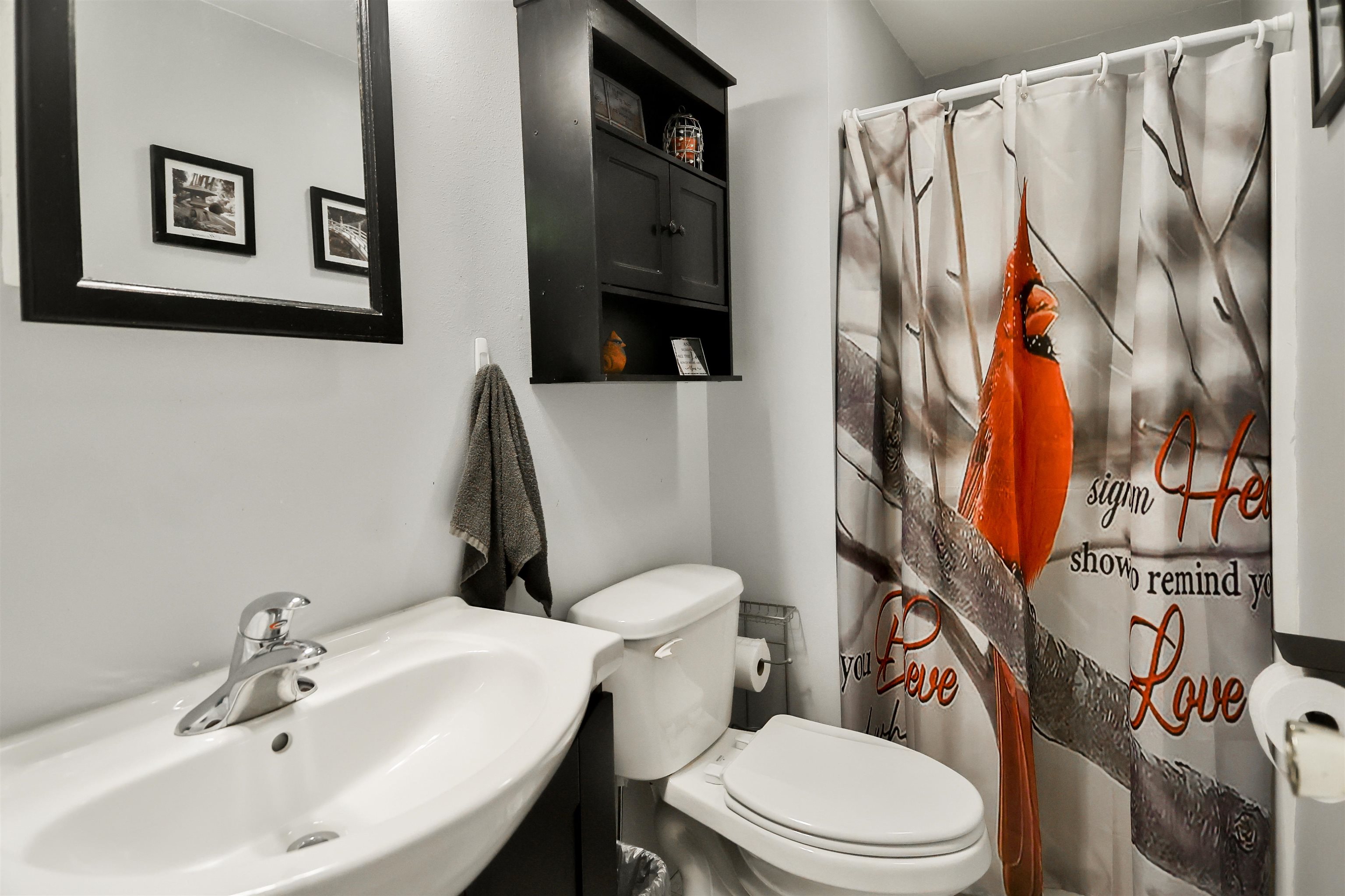 155 Lamplighter Loop Southeast Poplar Grove, IL 61065 - Photo 18 of 31 a white toilet sitting next to a bathroom sink