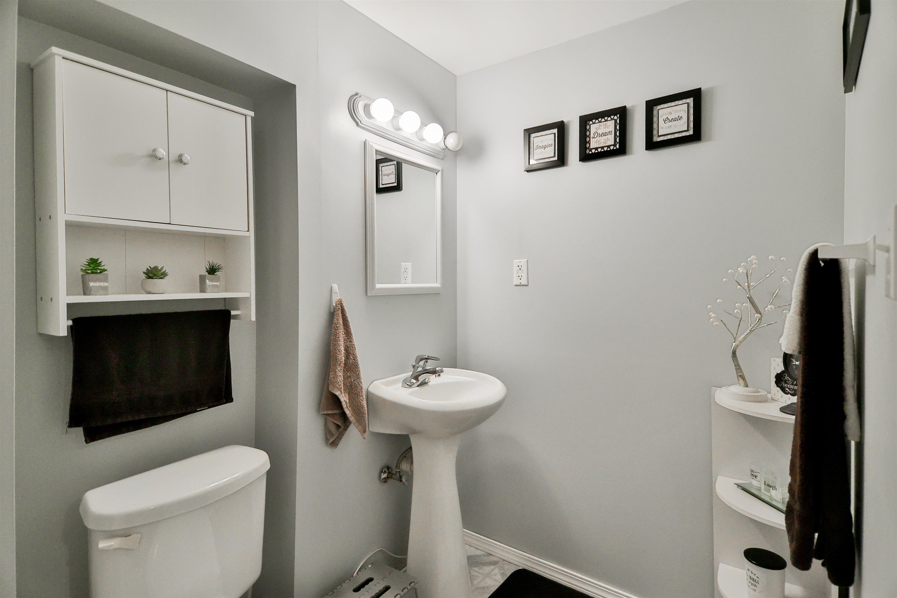 155 Lamplighter Loop Southeast Poplar Grove, IL 61065 - Photo 26 of 31 a bathroom with a toilet a sink and mirror