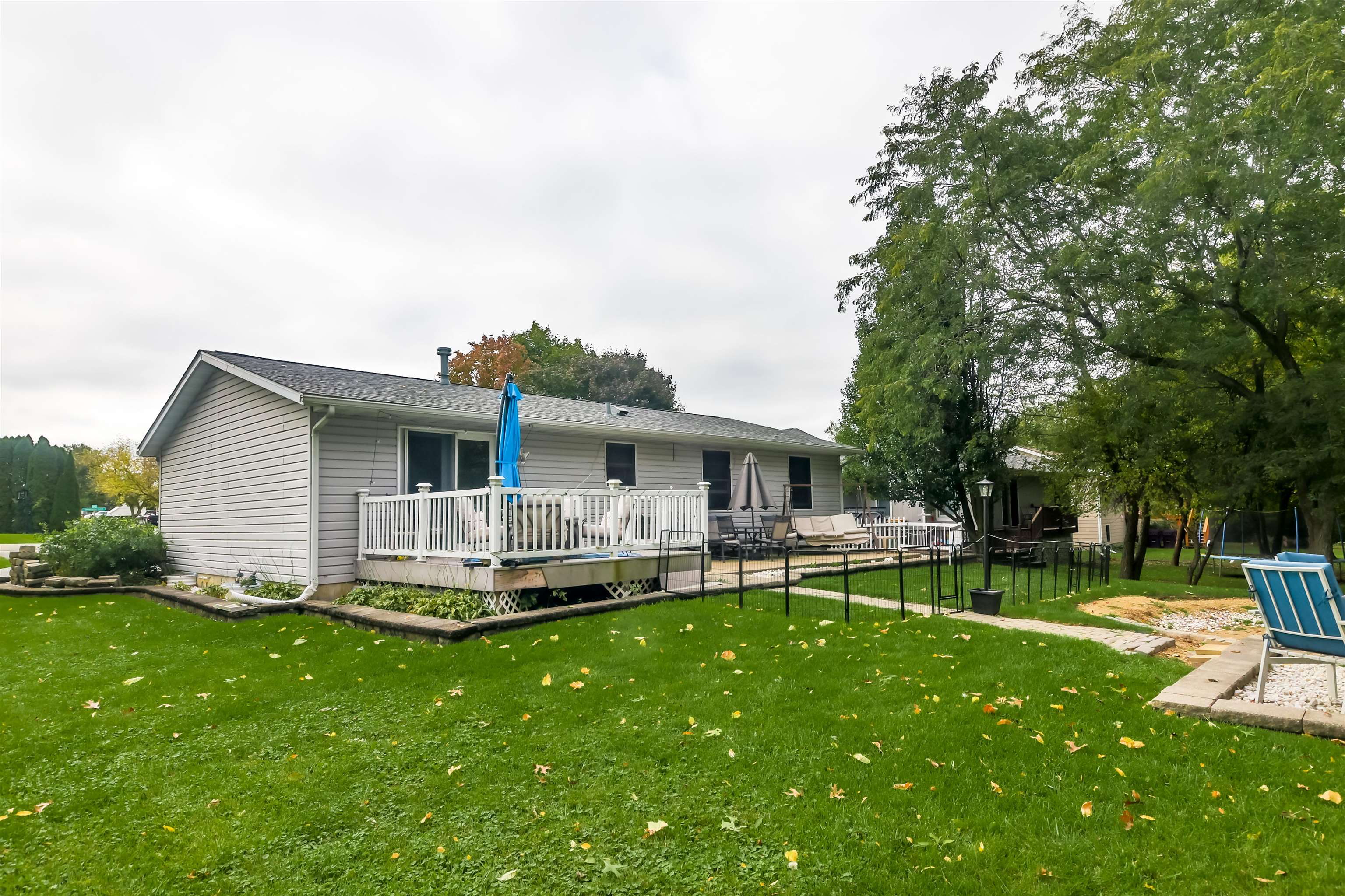 155 Lamplighter Loop Southeast Poplar Grove, IL 61065 - Photo 29 of 31 a front view of house with a garden and patio