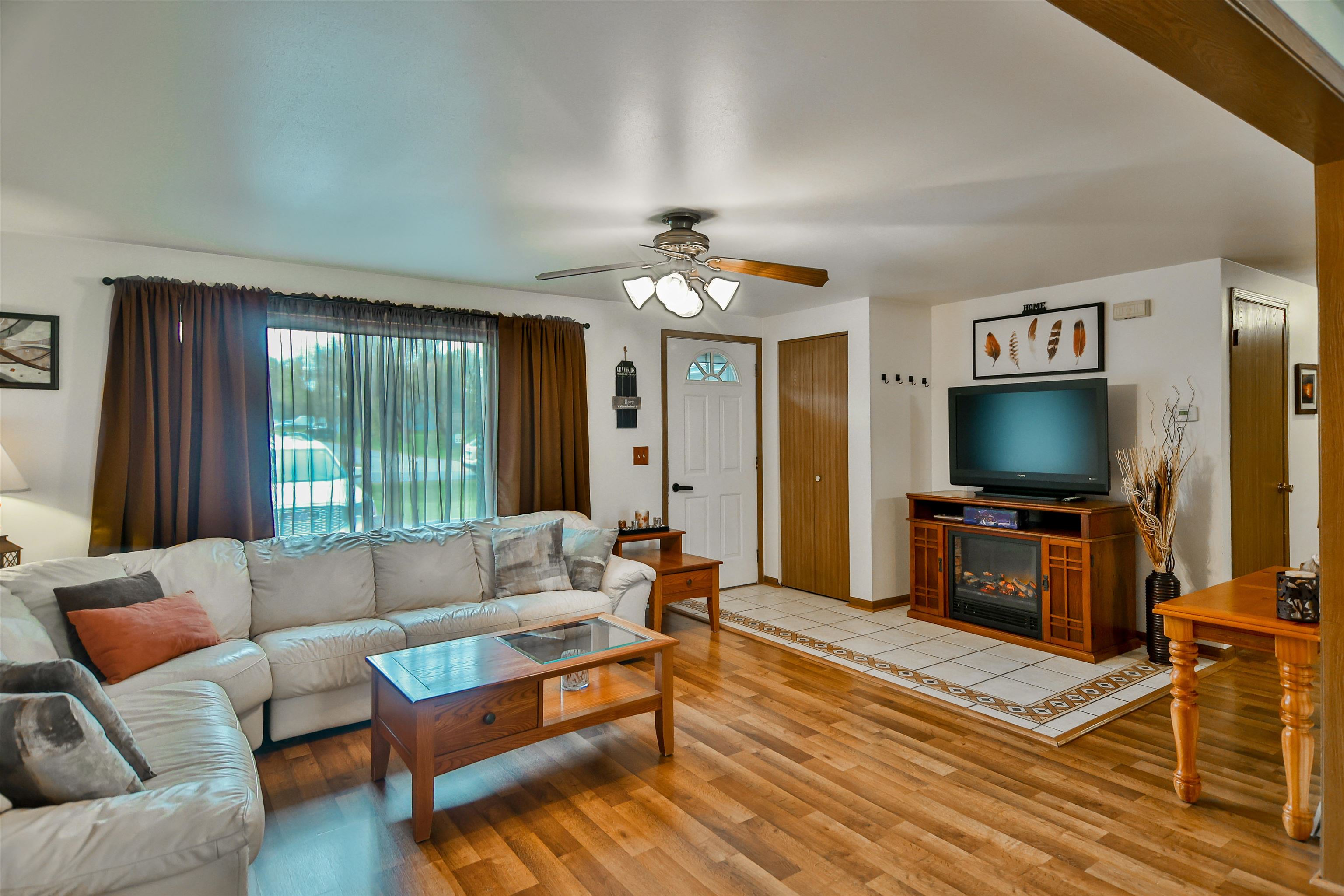 155 Lamplighter Loop Southeast Poplar Grove, IL 61065 - Photo 3 of 31 a living room with furniture and a flat screen tv