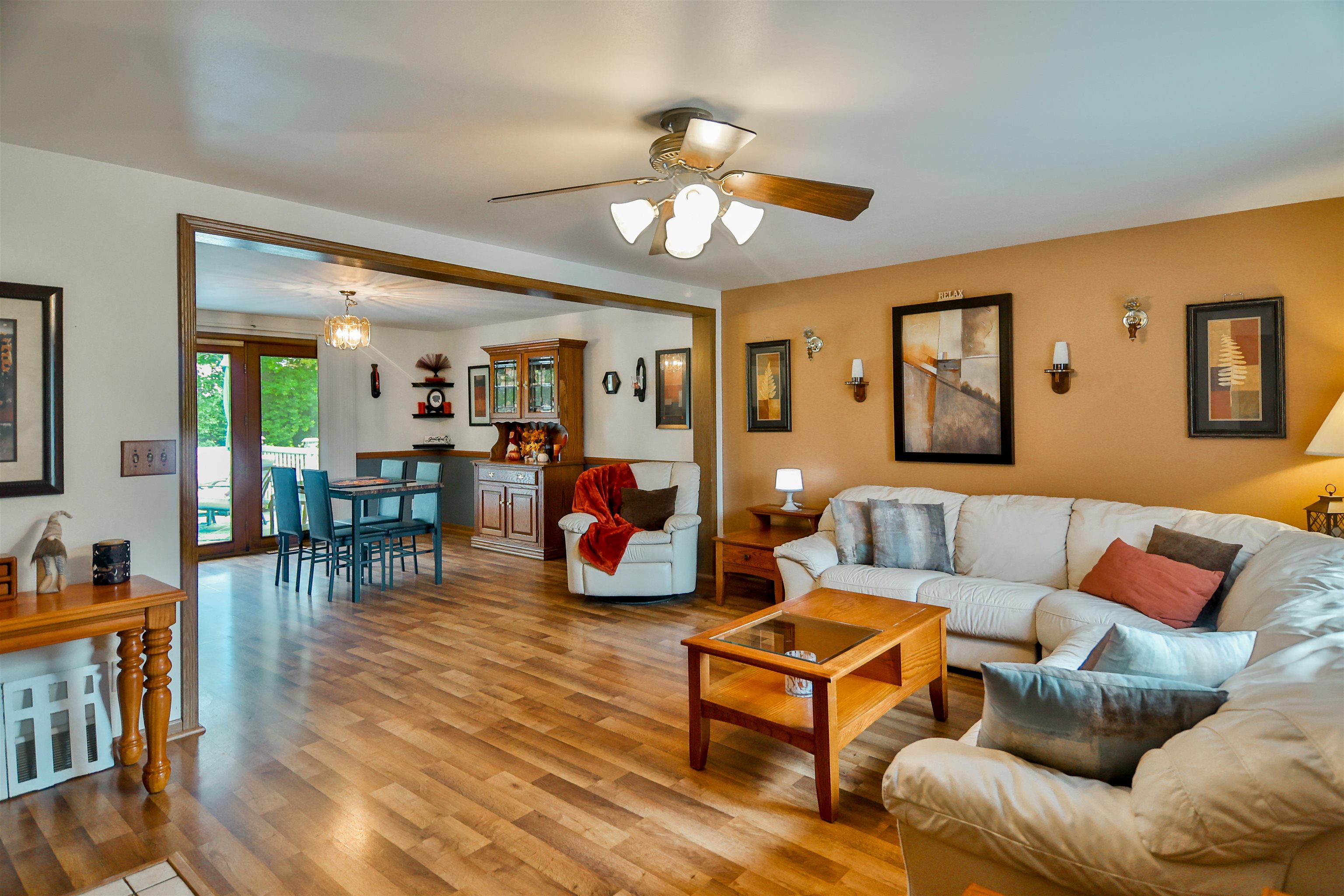 155 Lamplighter Loop Southeast Poplar Grove, IL 61065 - Photo 4 of 31 a living room with furniture a wooden floor and a chandelier