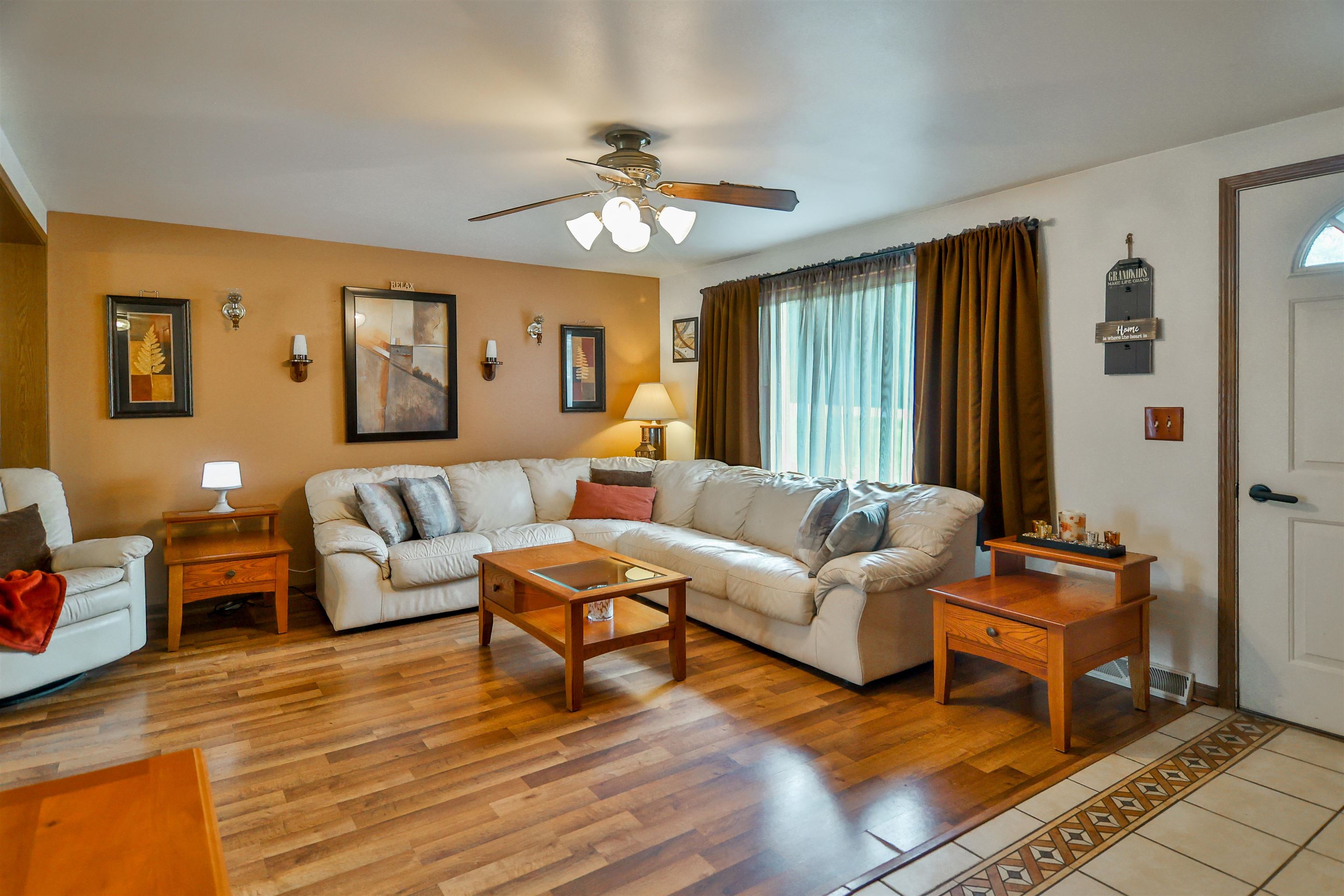 155 Lamplighter Loop Southeast Poplar Grove, IL 61065 - Photo 5 of 31 a living room with furniture and a large window
