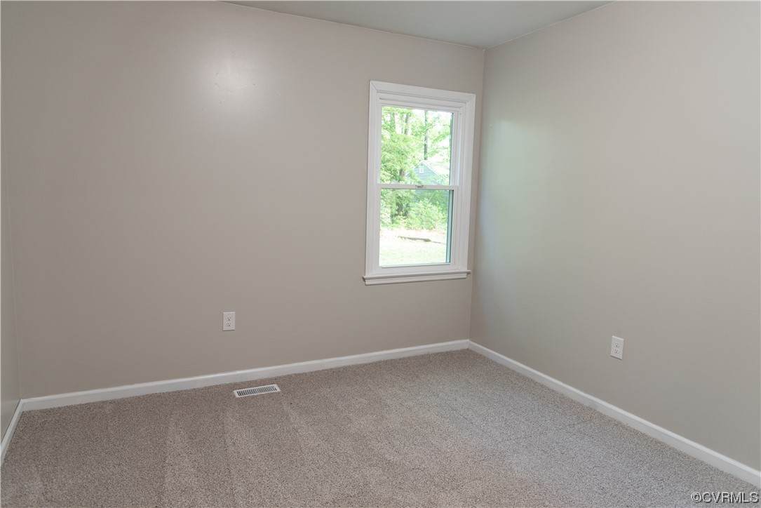 10807 Drayton Road Chester, VA 23831 - Photo 11 of 32 an empty room with a window