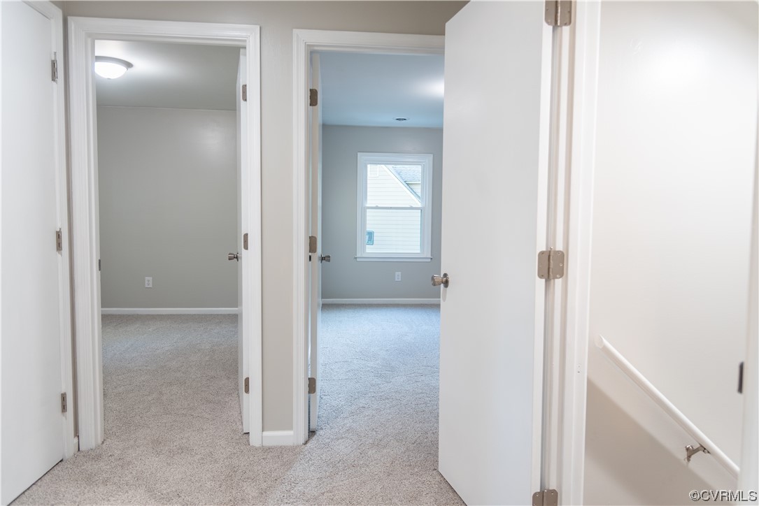10807 Drayton Road Chester, VA 23831 - Photo 25 of 32 a view of a hallway with a livingroom and a bathroom with a sink