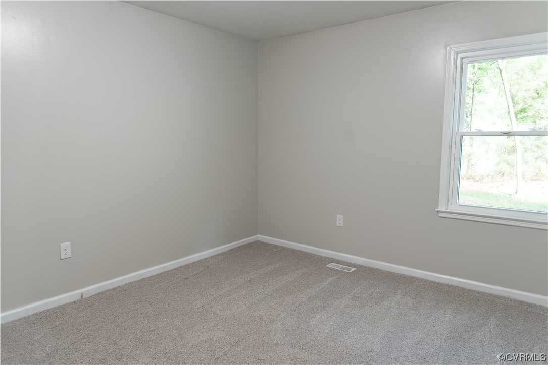 10807 Drayton Road Chester, VA 23831 - Photo 10 of 32 an empty room with a window