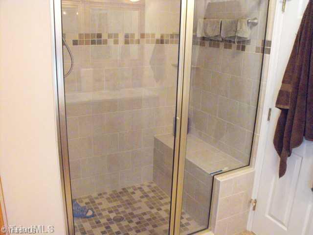 1185 Surry Line Road Pinnacle, NC 27043 - Photo 8 of 8 Master Bath/Spa. CUSTOM BUILT CERAMIC TILE SHOWER AND CUSTOM GLASS DOOR.