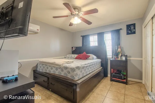 a bedroom with a bed and a table in it