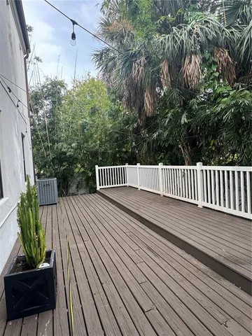 a view of balcony with wooden floor