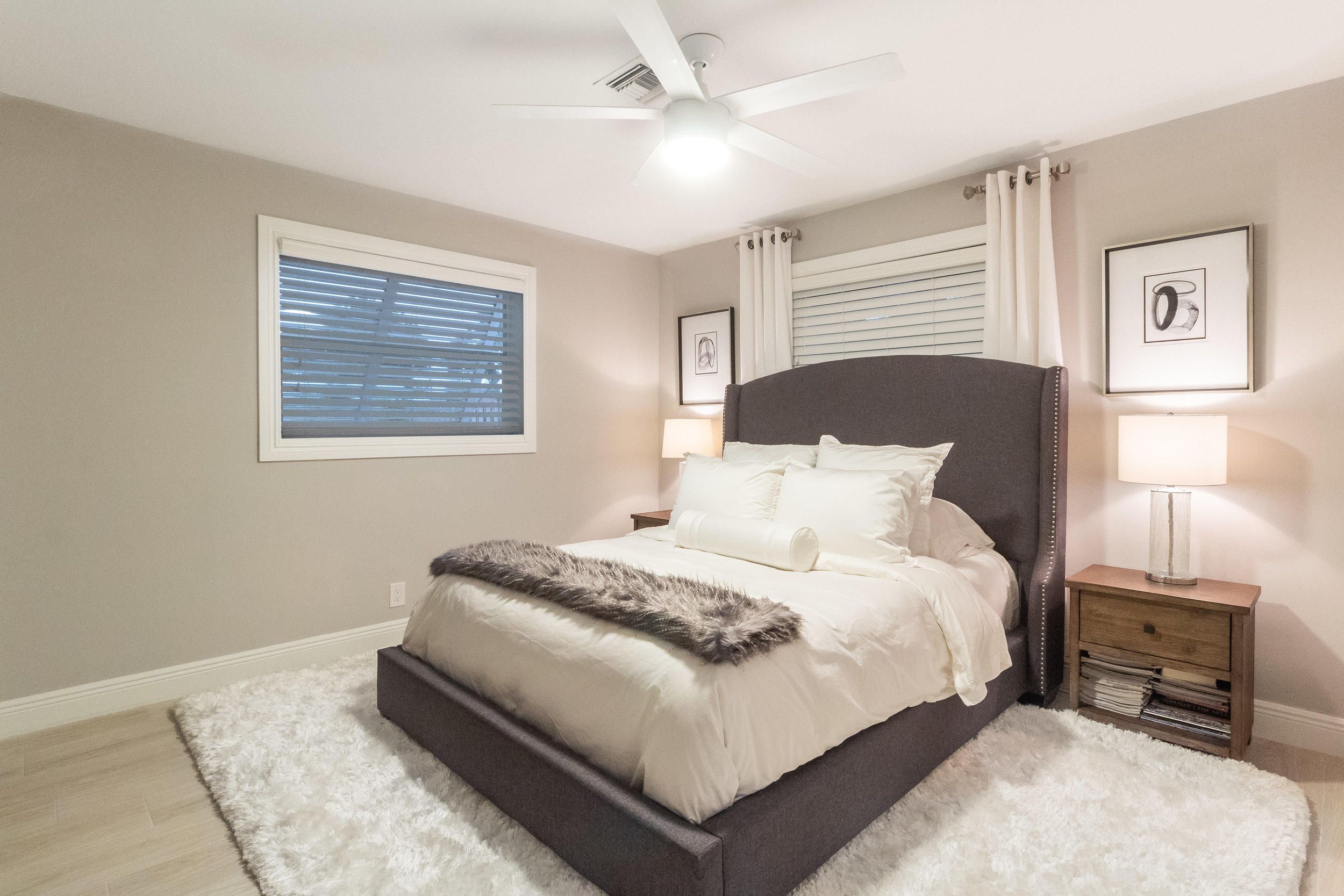 1241 Southwest 8th Street Boca Raton, FL 33486 - Photo 11 of 22 a bedroom with a bed and a tv