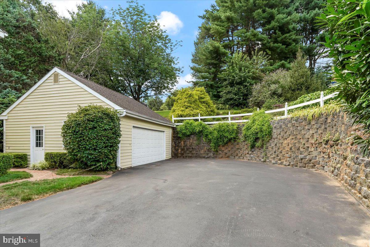 725 Beversrede Trail Kennett Square, PA 19348 - Photo 32 of 41 Detached two car garage and retaining wall
