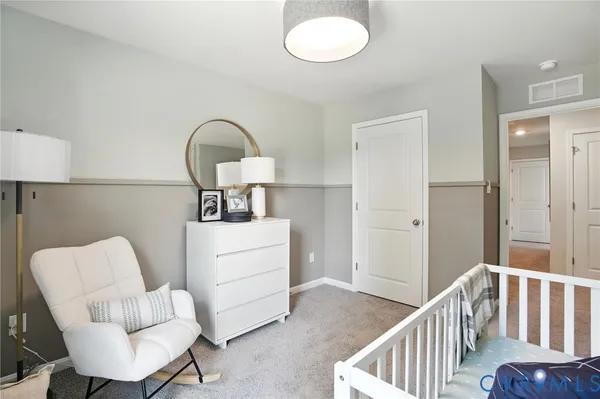 a bedroom with furniture and a window