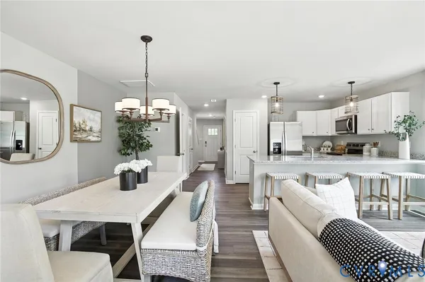 a large kitchen with a table and chairs