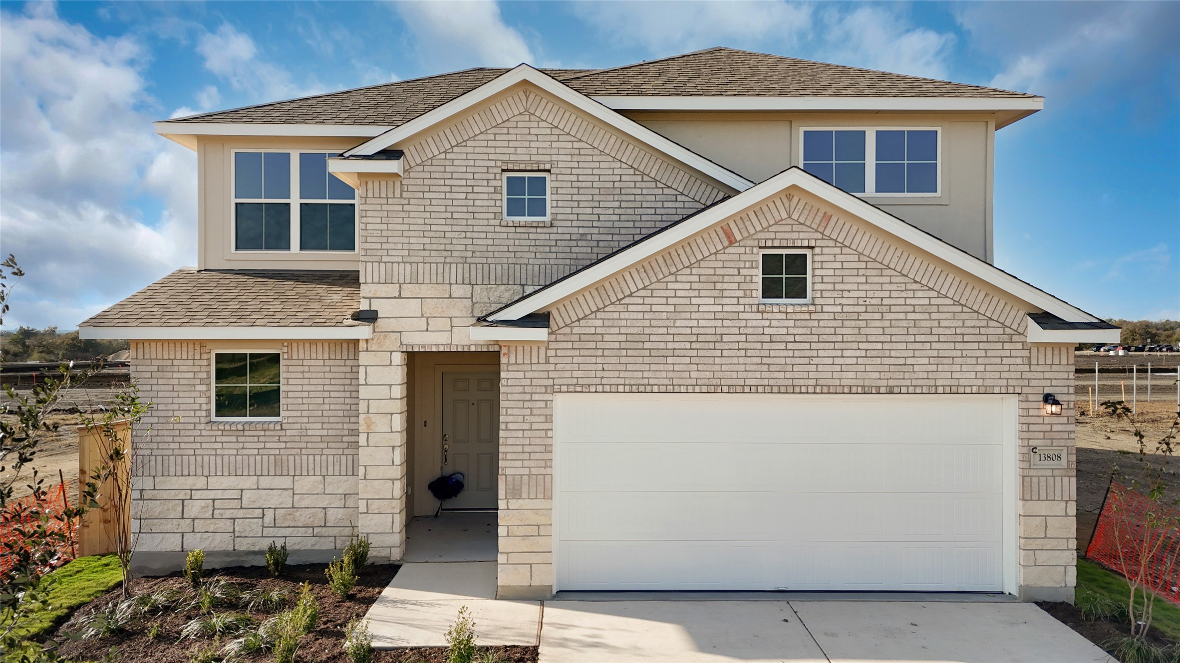 25628 Wheat Seed Lane Elgin, TX 78621 - Photo 14 of 20 View of front of property with driveway, roof with shingles, and brick siding
