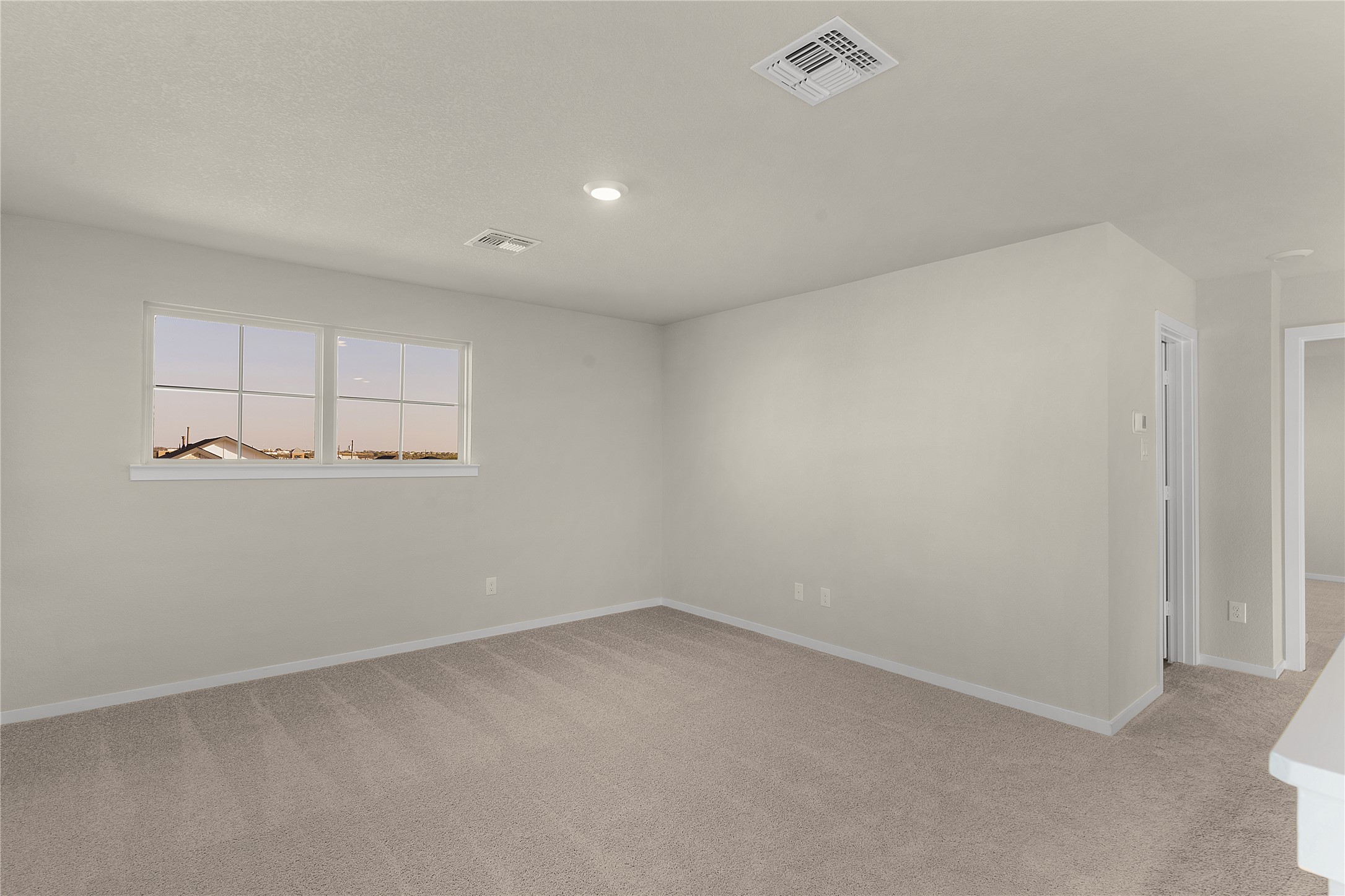 25628 Wheat Seed Lane Elgin, TX 78621 - Photo 16 of 20 Unfurnished room featuring light carpet and baseboards