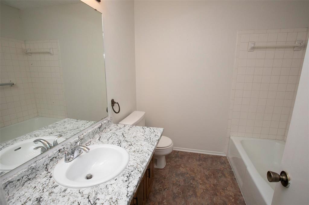 1202 Randy Drive Graham, TX 76450 - Photo 14 of 40 a bathroom with a sink and a mirror