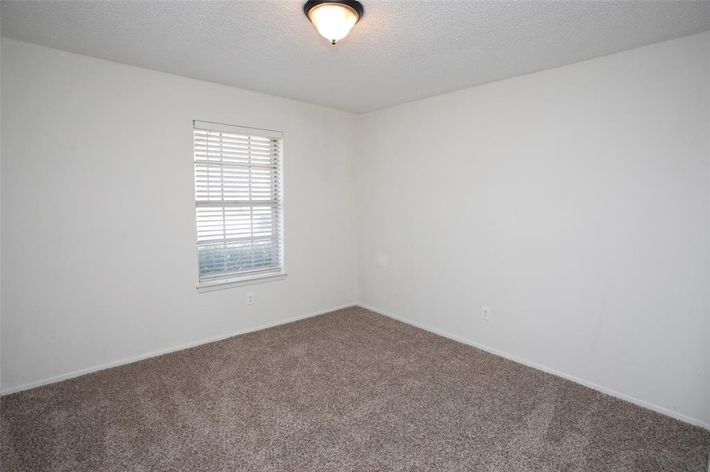 1202 Randy Drive Graham, TX 76450 - Photo 17 of 40 an empty room with a window