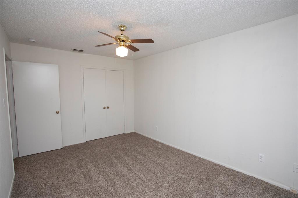 1202 Randy Drive Graham, TX 76450 - Photo 20 of 40 a view of a room with a fan and a fan