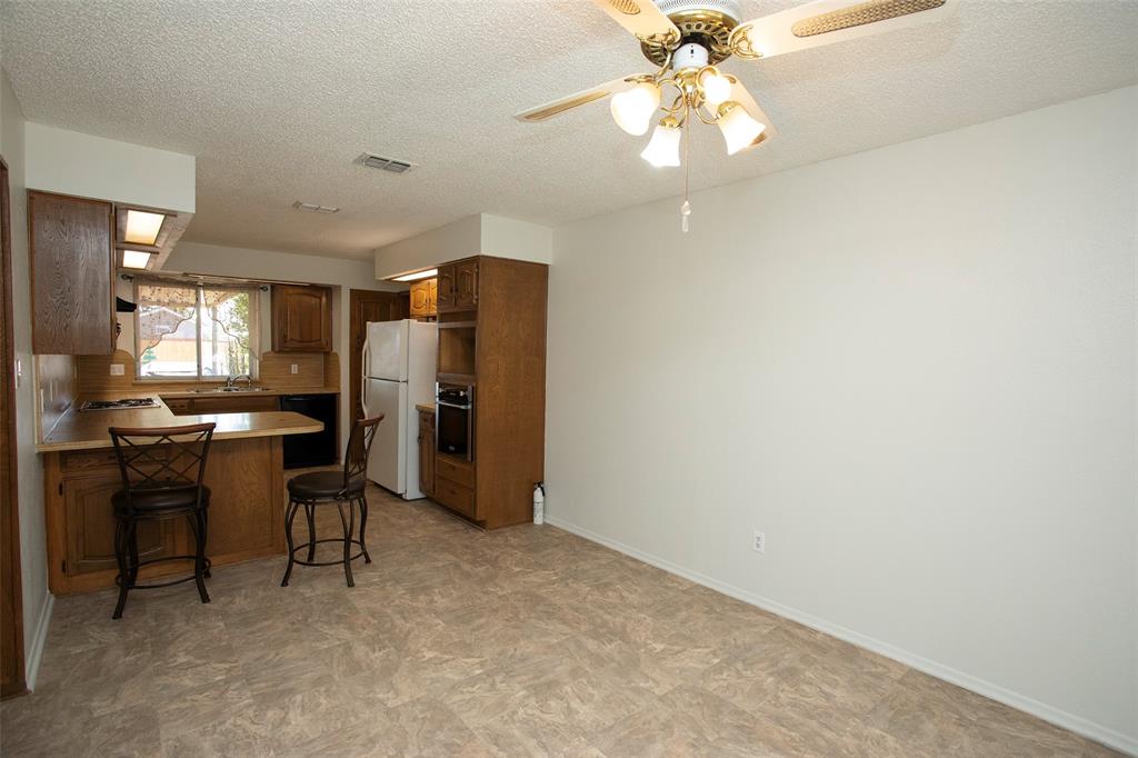 1202 Randy Drive Graham, TX 76450 - Photo 22 of 40 a view of kitchen with refrigerator stove and cabinets