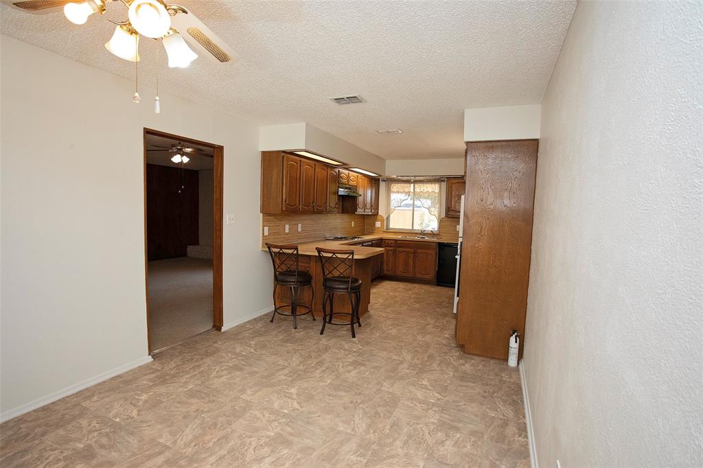 1202 Randy Drive Graham, TX 76450 - Photo 23 of 40 a view of workspace with furniture and a chandelier