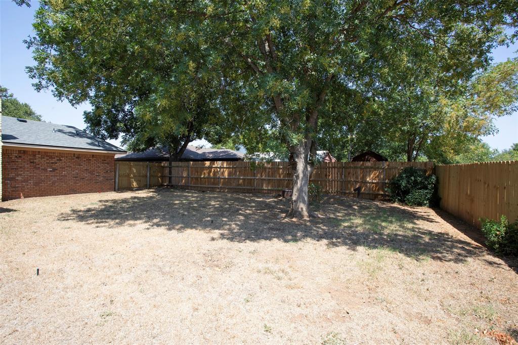 1202 Randy Drive Graham, TX 76450 - Photo 36 of 40 a view of a backyard with a tree